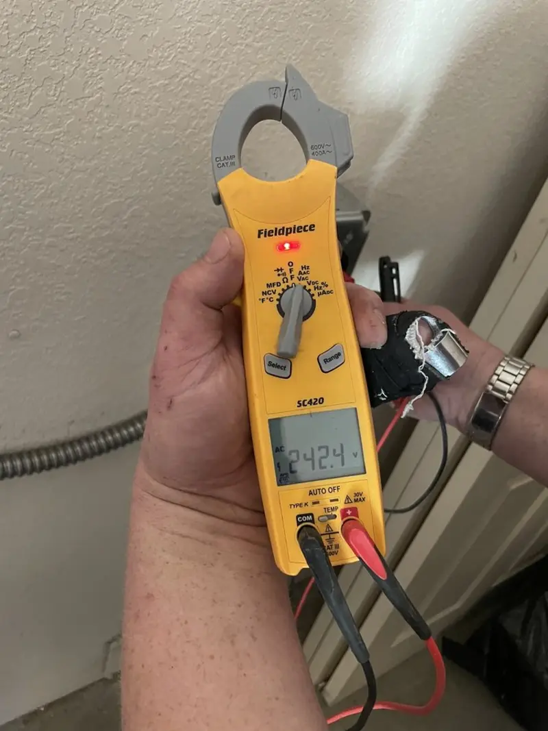 Voltage testing with clamp meter during Ceiling Fan Installation in Jonesboro